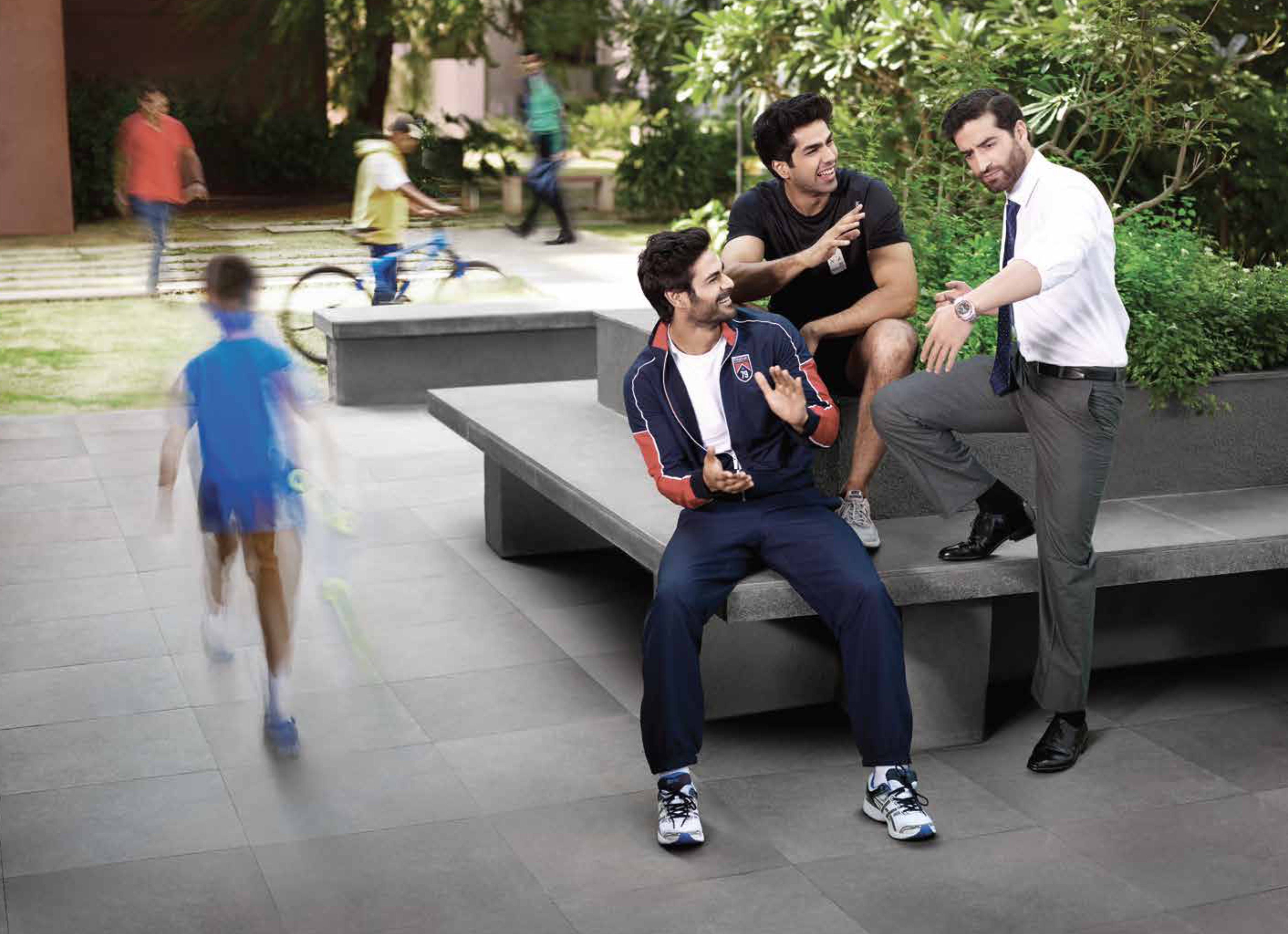 Landscaped outdoor seating area with people at Marvel Piazza.