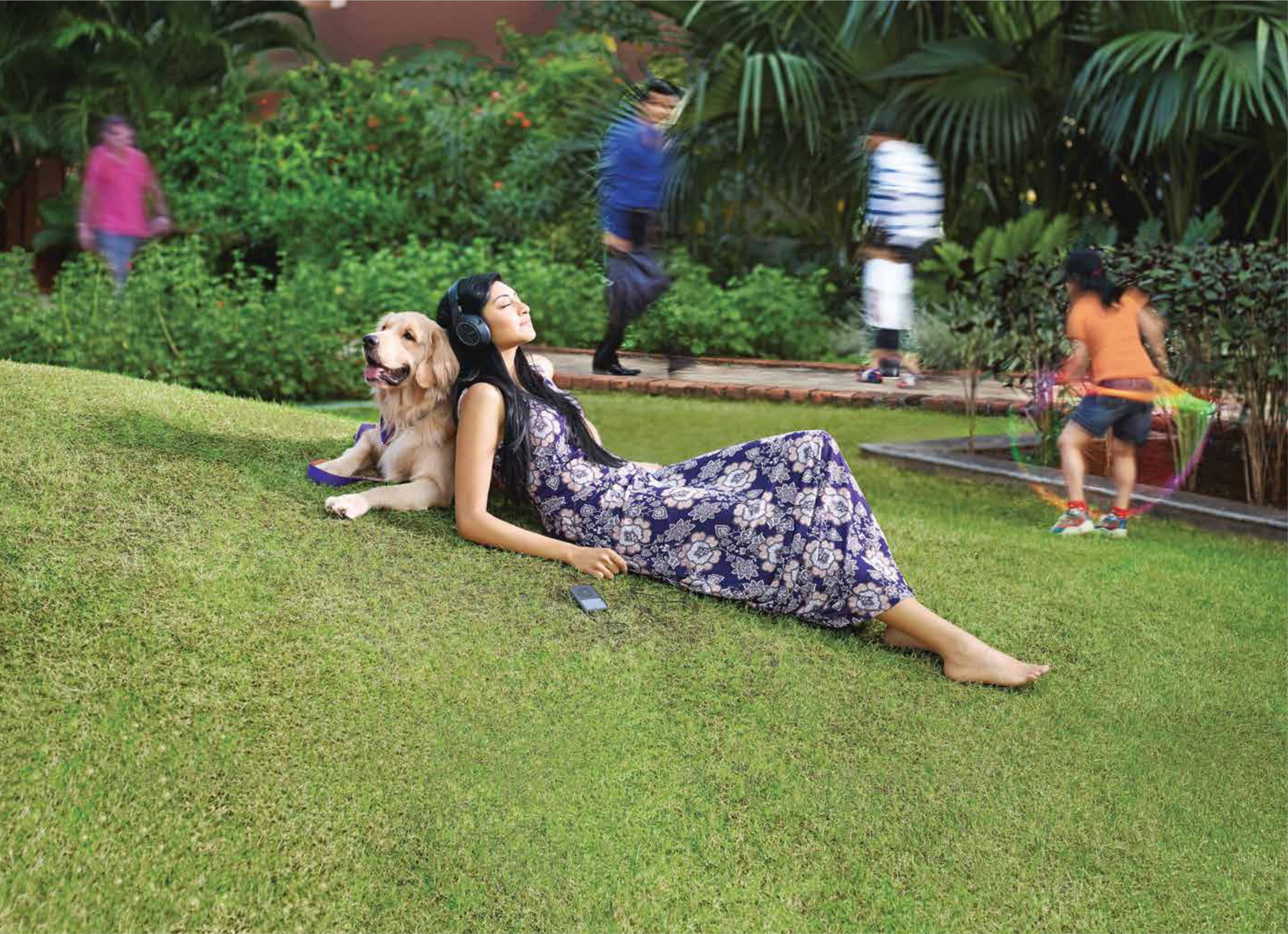 Landscaped lawn with a walking path at Marvel Piazza.